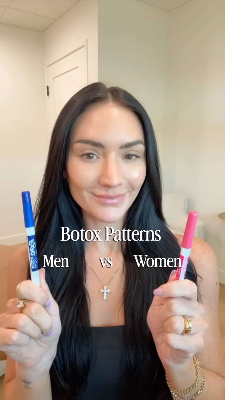 Torey Varner, RN, holding a blue and a red marker before mapping the men and women Botox patterns on her own forehead at MODE in Scottsdale.