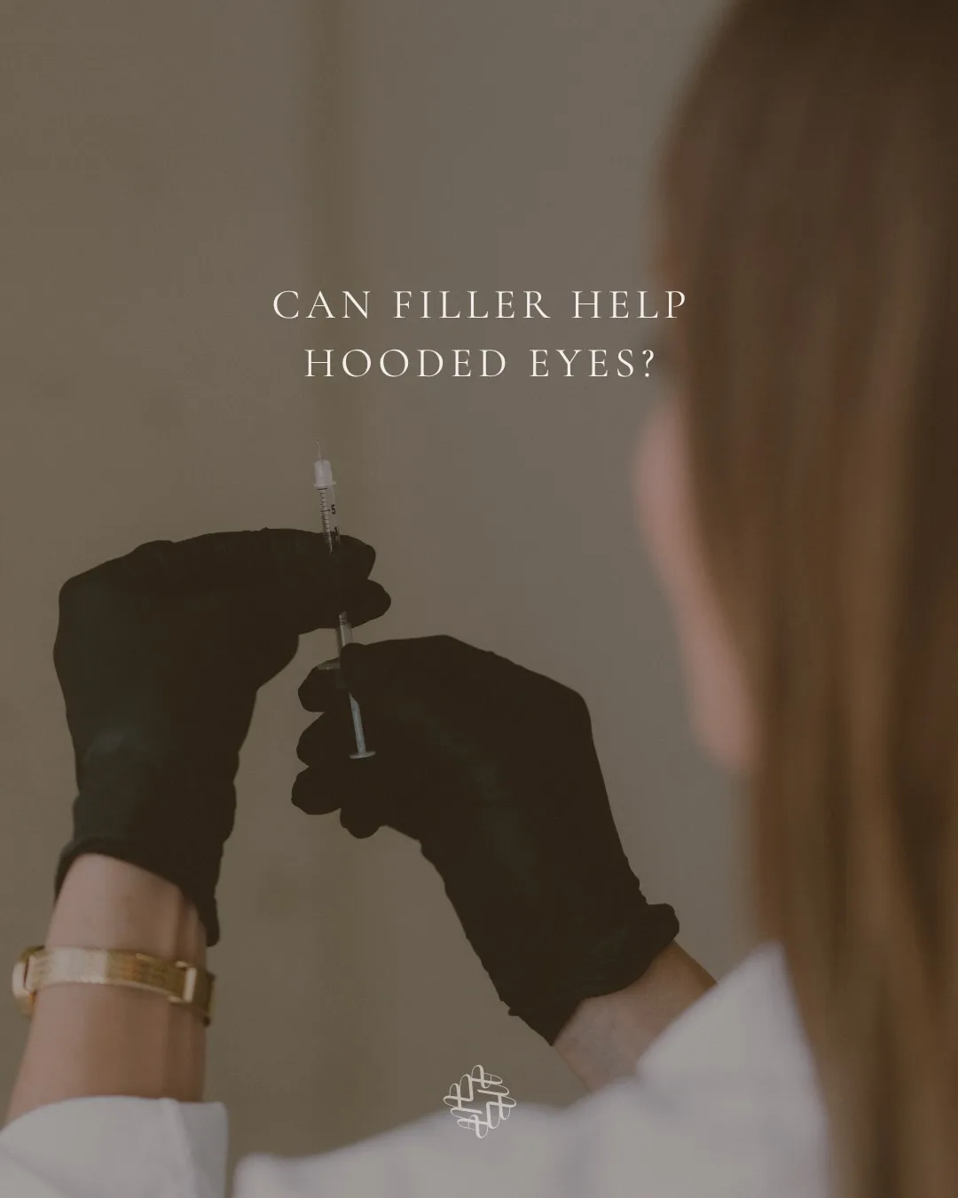 A MODE Aesthetics and Wellness nurse injector in black gloves holding a filler syringe in Scottsdale, the title card of the practice’s carousel asking whether filler can help hooded eyes. No patient is shown.